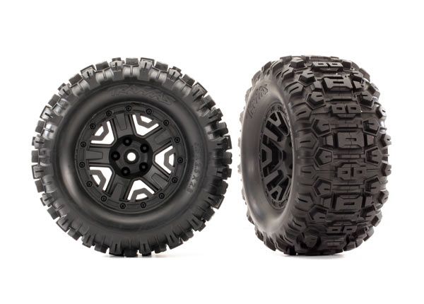 Traxxas Tires & wheels, assembled, glued (2.8") (Rustler 4X4 black wheels, Sledgehammer tires, foam inserts) (2) (TSM rated)