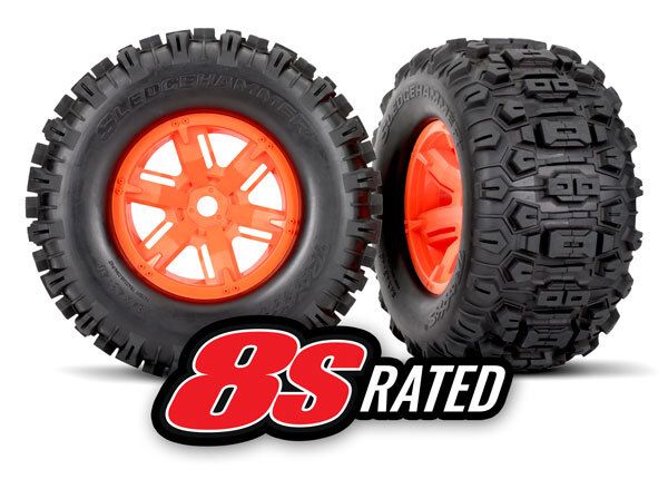 Traxxas Tires & wheels, assembled, glued (X-Maxx orange wheels, Sledgehammer tires, foam inserts) (left & right) (2)