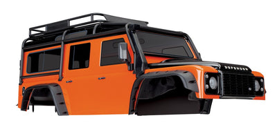 Traxxas Body, Land Rover Defender, adventure orange (complete with ExoCage, inner fenders, fuel canisters, and jack)